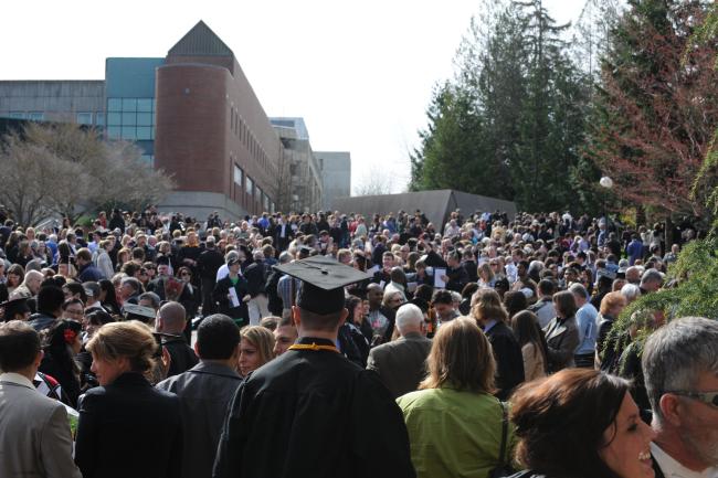 Crowd of WWU graduates and their families at Carver Gym after Commencement.
