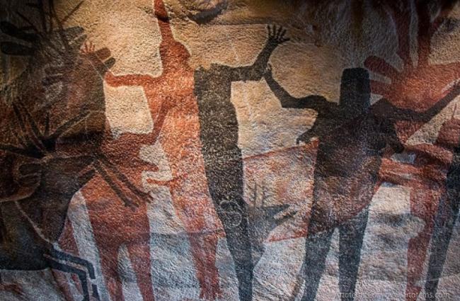 ancient cave paintings of people and animals 